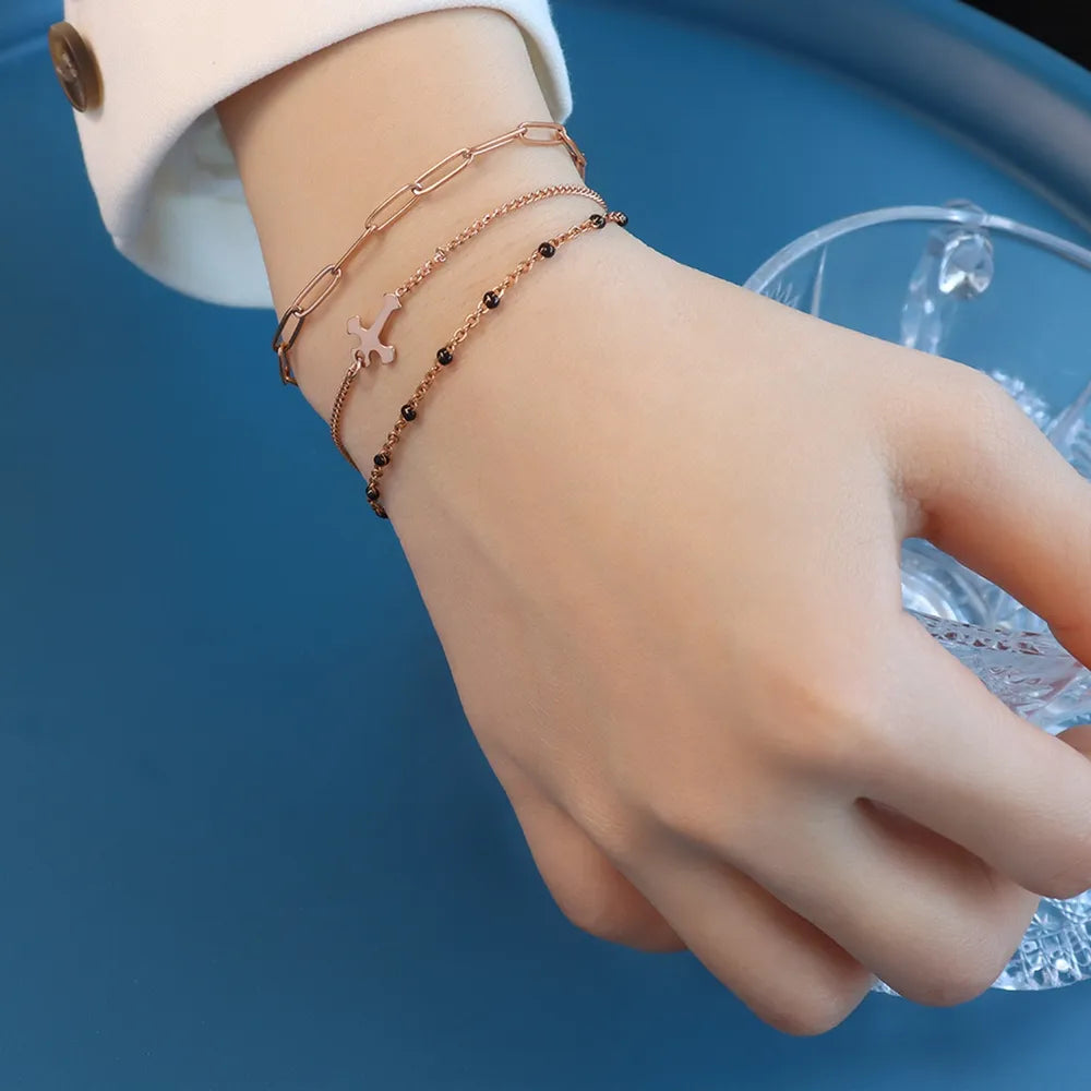 Minimalist Titanium Steel Three-Layered Chain and Bead Bracelet for Women.