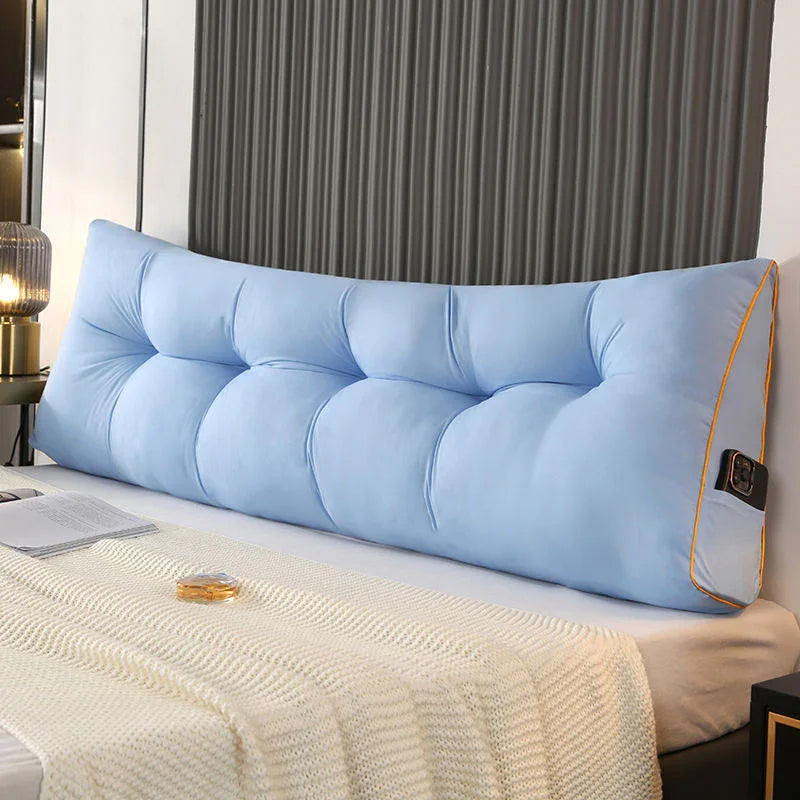 Large light blue tufted bed wedge pillow with side pocket on modern bedroom bed