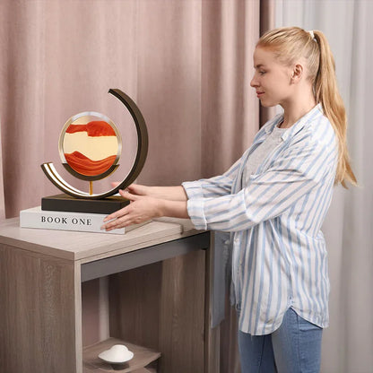 Woman placing modern sand art sculpture on table in stylish living room