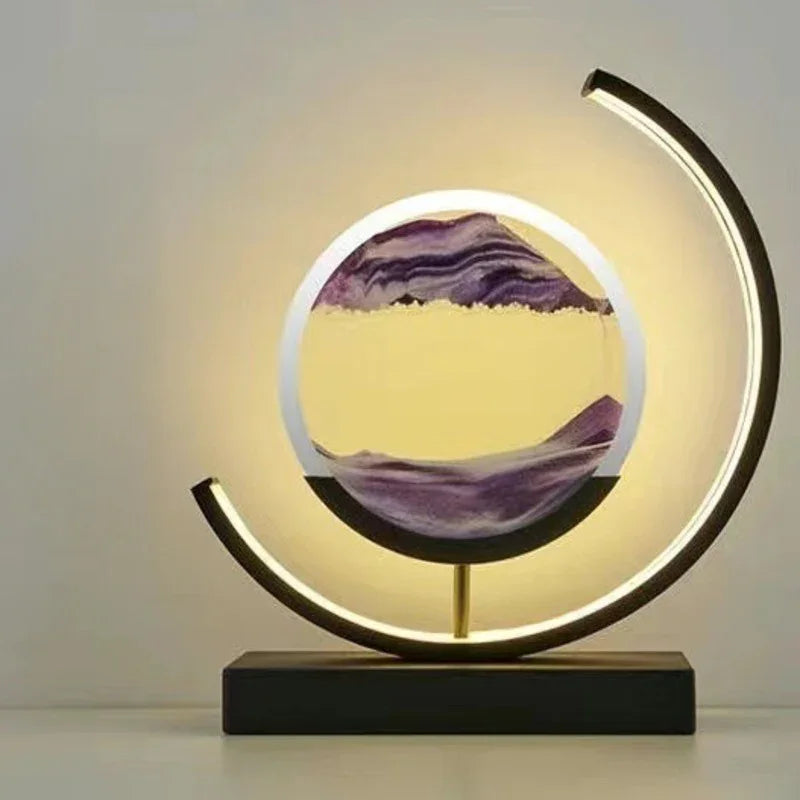 Modern LED sand art lamp with purple sand and circular frame on a tabletop
