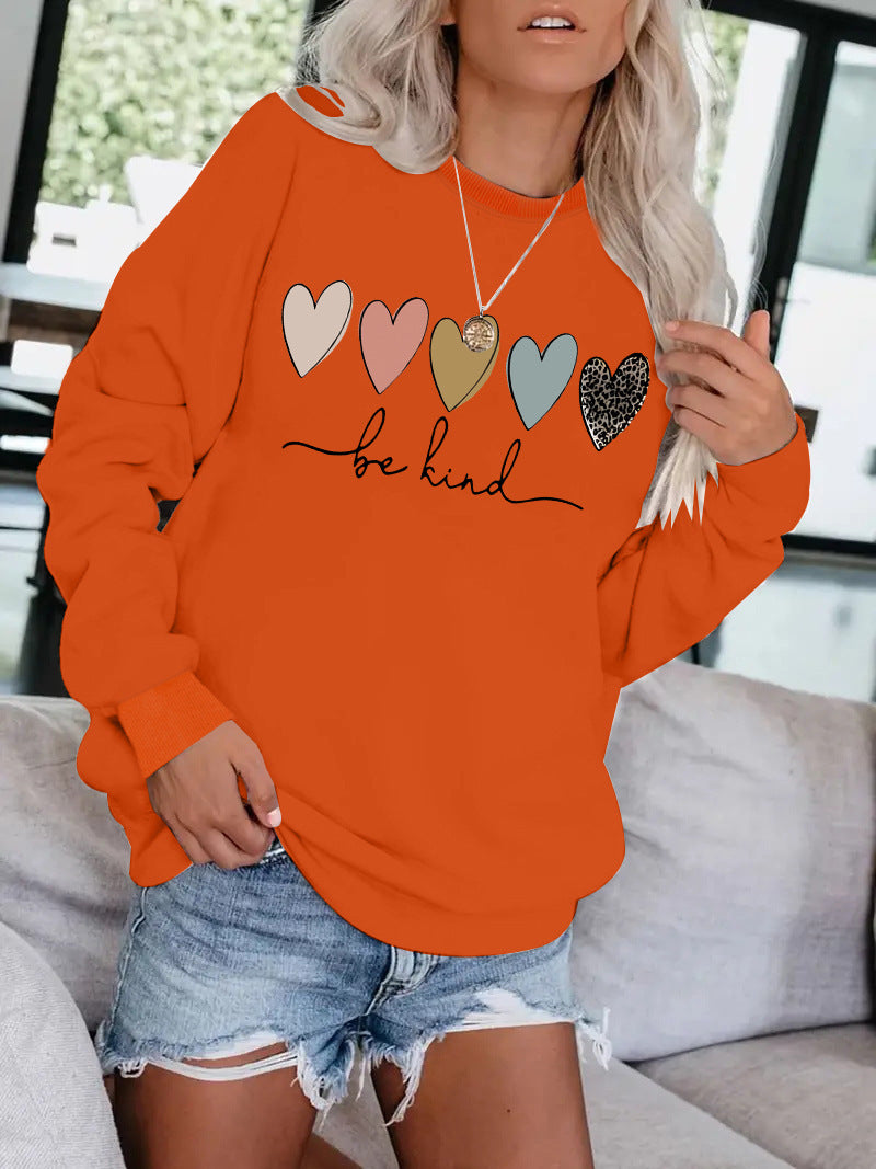 Be Kind" Multicolor Heart Print Black Sweatshirt | Cozy Women's Love Graphic Pullover