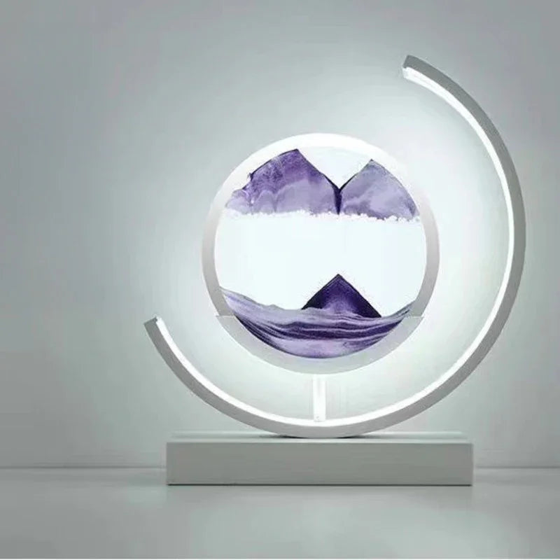 Modern LED table lamp with circular sand art design and purple mountain landscape