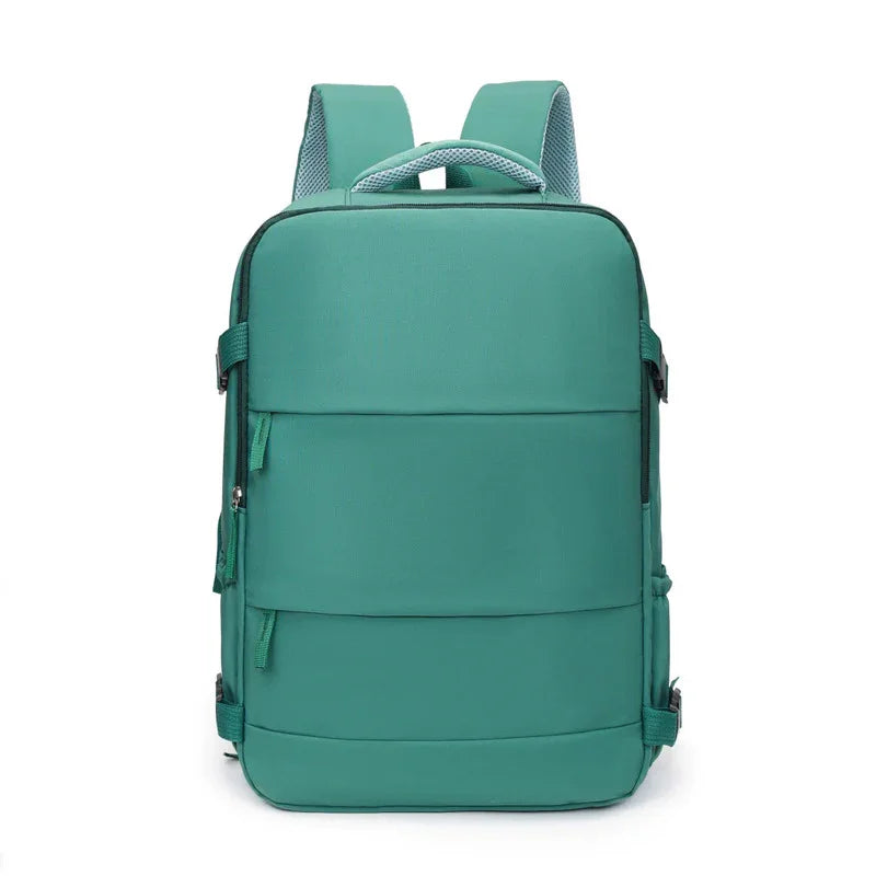 Modern teal backpack with padded straps and minimalist front design, isolated on white background.