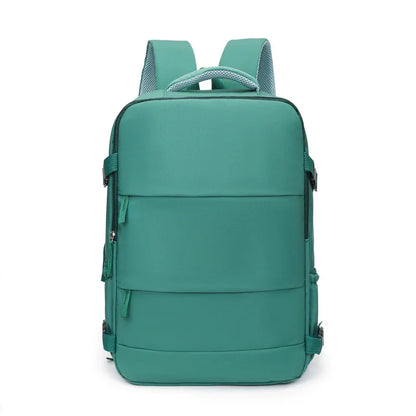 Modern teal backpack with padded straps and minimalist front design, isolated on white background.