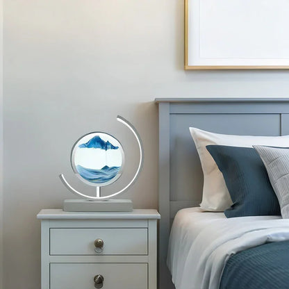 Modern bedside lamp with circular sand art on nightstand in cozy bedroom setting