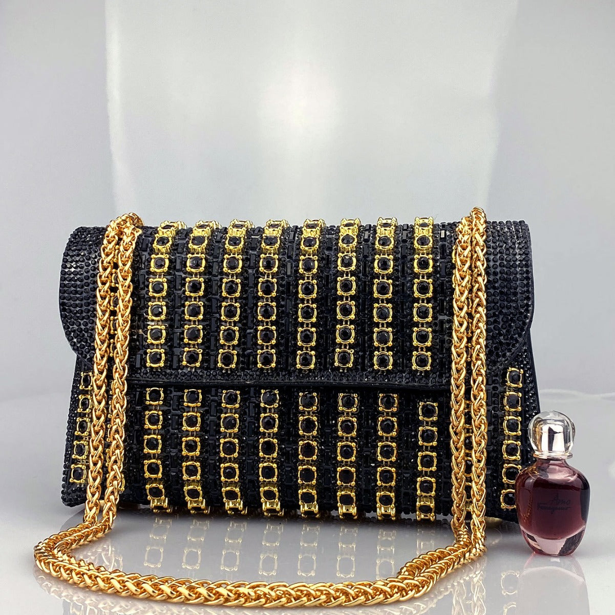 Elegant Black and Gold Chain-Adorned Evening Clutch Bag with Long Strap
