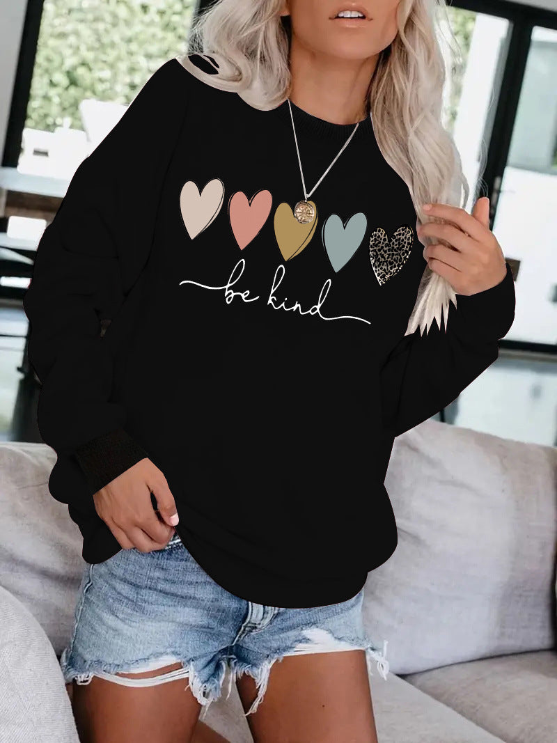 Be Kind" Multicolor Heart Print Black Sweatshirt | Cozy Women's Love Graphic Pullover