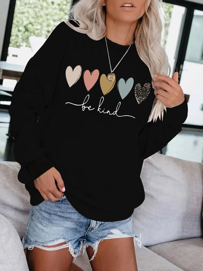 Be Kind" Multicolor Heart Print Black Sweatshirt | Cozy Women's Love Graphic Pullover