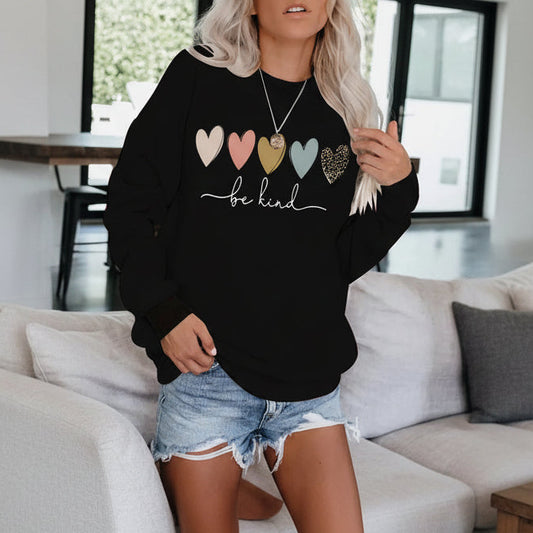 Be Kind" Multicolor Heart Print Black Sweatshirt | Cozy Women's Love Graphic Pullover
