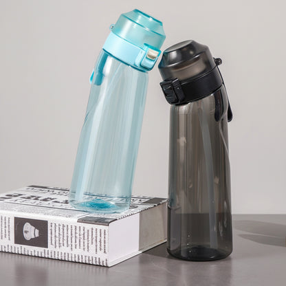 Two water bottles on a table with promotional text about a new drinking experience.