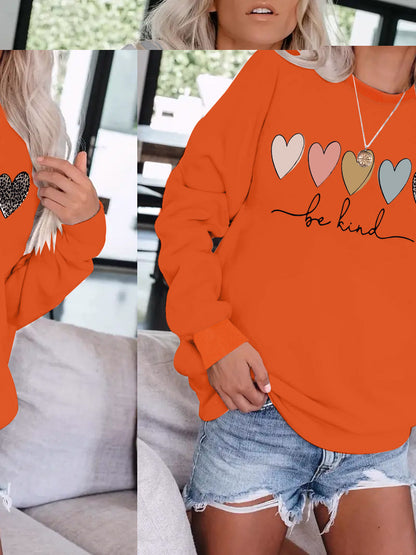 Be Kind" Multicolor Heart Print Black Sweatshirt | Cozy Women's Love Graphic Pullover