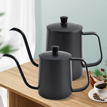 Two black ceramic pour-over coffee pots on a wooden surface with a blurred background.