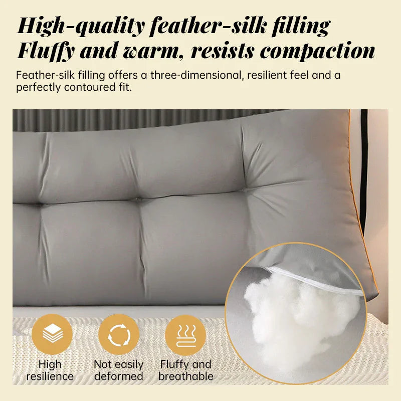 Gray tufted pillow with feather-silk filling, highlighting fluffy, breathable, high-resilience material.
