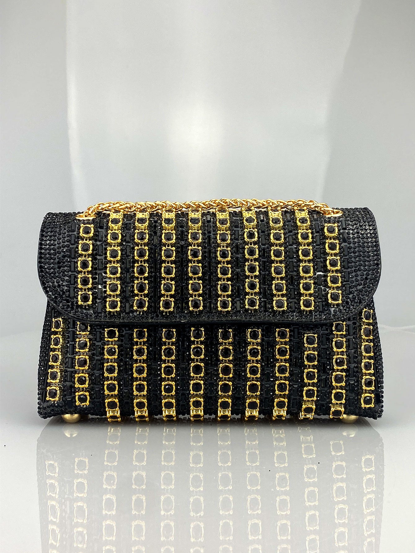 Elegant Black and Gold Chain-Adorned Evening Clutch Bag with Long Strap