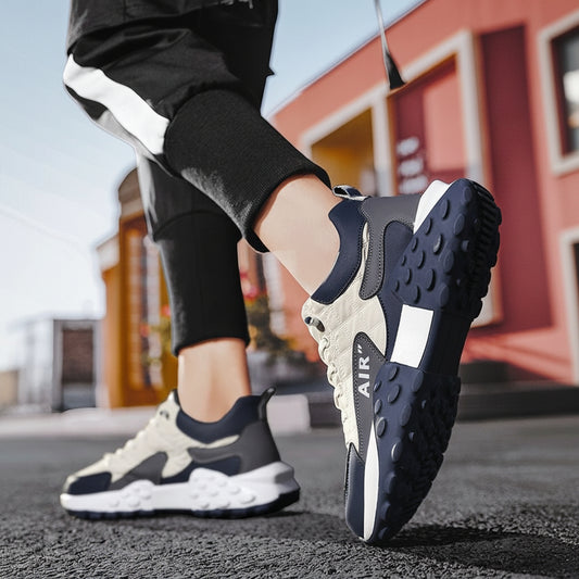 Person wearing black and white sneakers on a street with blurred background