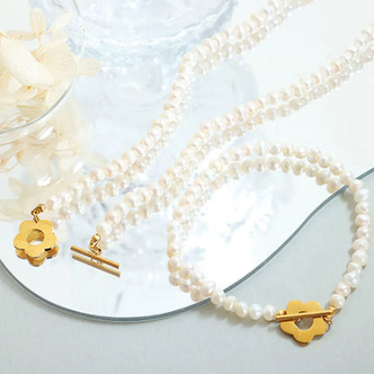 Delicate Women's Titanium Steel Pearl Flower Charm Bracelet.