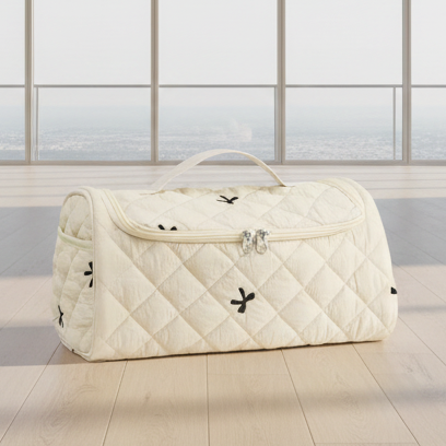 Quilted beige toiletry bag with measurements on a beige background
