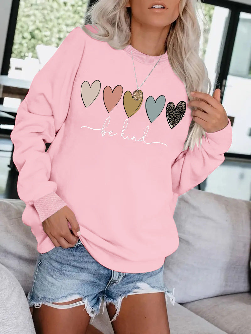 Be Kind" Multicolor Heart Print Black Sweatshirt | Cozy Women's Love Graphic Pullover