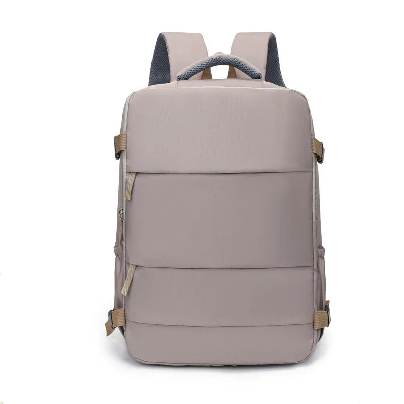 Modern beige backpack with padded design and adjustable straps, ideal for travel or school.
