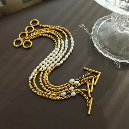 Luxury Women's Titanium Steel Stacked Bracelet with Delicate Pearl Strands.