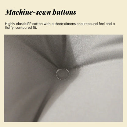 Close-up of tufted cushion with machine-sewn button and grey PP cotton fabric.