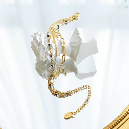 Minimalist Titanium Steel Three-Layered Chain and Bead Bracelet for Women.