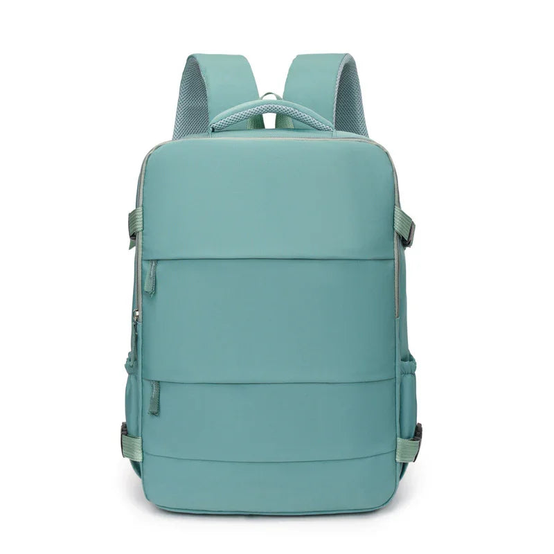 Minimalist teal backpack with padded straps, front zipper pocket, and modern design