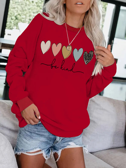 Be Kind" Multicolor Heart Print Black Sweatshirt | Cozy Women's Love Graphic Pullover